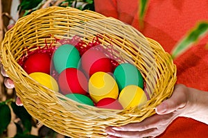 Basket with colorful Easter eggs