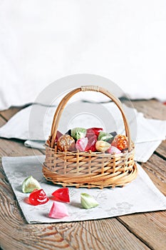 Basket with colorful sweet candies photo