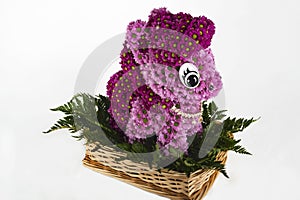 Basket with a composition of fresh cut flowers in the form of My Little Pony