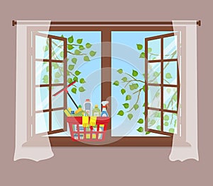 Basket with detergents on the windowsill. Cleaning concept