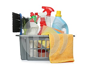 Basket with different cleaning products and tools on white background