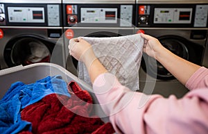 Basket of dirty clothes in the laundry with kind of a washing machines, washing house