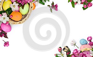 Basket with Easter eggs and flowers apple tree on a white background with space for text. Easter decoration. Top view, flat lay