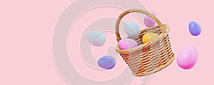Basket with Easter eggs over pink