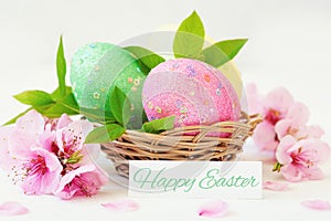 Basket with easter eggs on white background