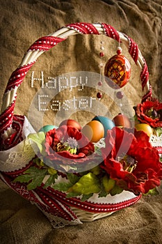 Basket with eggs and greeting Happy Easter