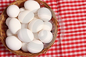 Basket of Farm Fresh Eggs on Red and White Checkered Fabric