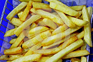 Basket with french fries. Food accepted worldwide. Starch with high caloric value. fast food