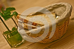 Basket of fresh bread and mint lemonade photo