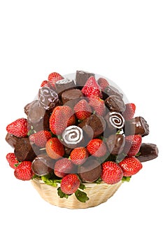 Basket with fruits and berries in chocolate isolated on white background. Handmade. Strawberries and bananas in