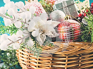 Basket full of Christmas decorations. Snow