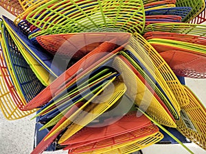 Basket full of colorful fly swatters