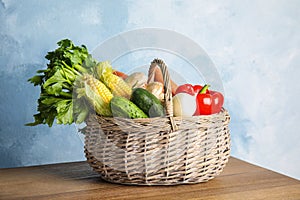 Basket full of fresh healthy vegetables on table