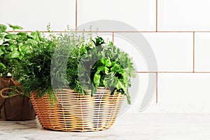 A basket full of fresh herbs on the kitchen