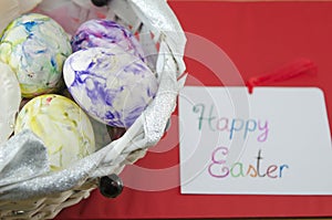 Basket full of handcolored Easter Eggs in decoupage photo