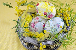 Basket full of handcolored Easter Eggs in decoupage