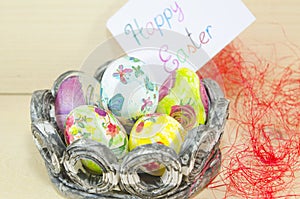 Basket full of handcolored Easter Eggs in decoupage photo