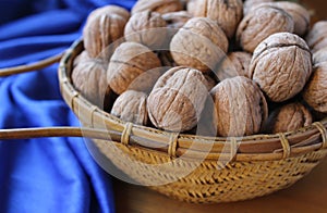 Basket Full of Tasty Walnuts, Blue Background