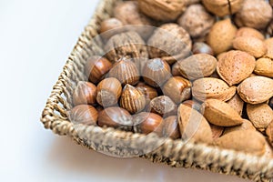 Basket with hazelnuts and almonds