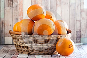 Basket with juicy oranges.