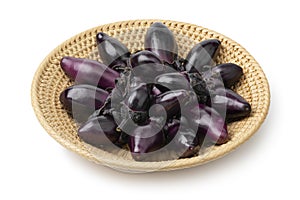 Basket with mini purple eggplants isolated on white background