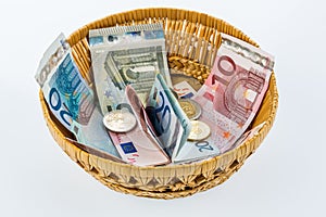 Basket with money from donations photo