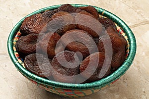 Basket with natural unsulphured sun dried Turkish apricots fruit