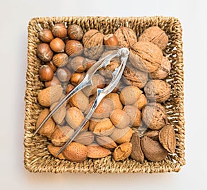Basket with nuts and nutcracker