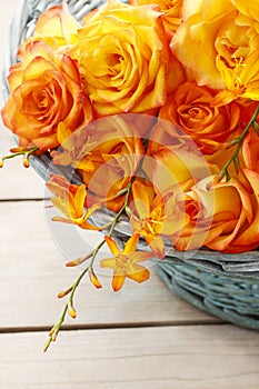 Basket of orange roses