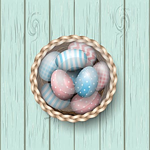 Basket with painted easter eggs on blue wooden background, illustration