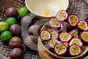 Basket passion fruits and passiflora edulis cut in half