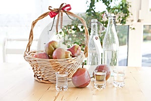 A basket with pears and pear schnapps