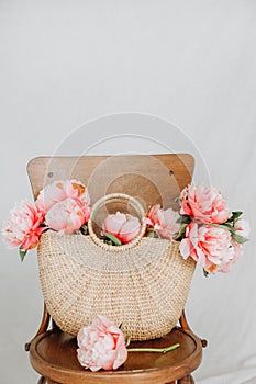 Basket peony flowers viennese chair white background
