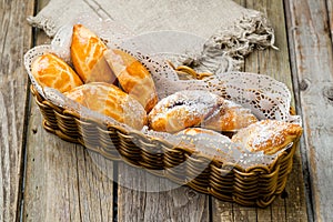 basket with pies on wooden table