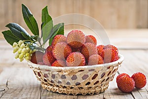 Basket with ripe arbutus unedo fruits