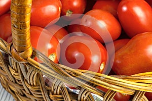 Basket with ripe fresh tomatoes