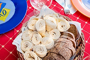 Basket with rye bread and lavash on the table