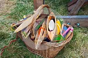 Basket with spindles and multicolored woolen yarn for hand weaving and spinning