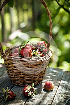 Basket of strawberry on rustic table