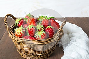 Basket of strawberry on wooden table