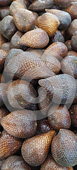 a basket of sweet and fresh salak pondo at the Malang city market photo