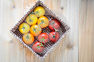 Basket with ten tomatoes