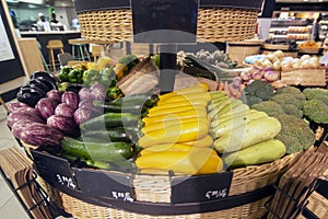 Basket of varied vegetables, zucchini, aubergines, broccoli, peppers, artichokes etc photo