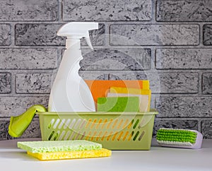 Basket with various cleaning supplies and detergents