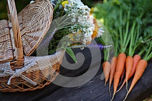 Basket with vegetables and flowers from the vegetal garden