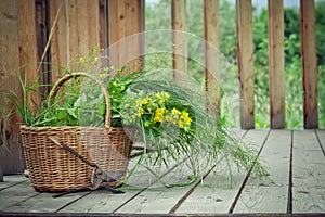 Basket of wild flowers and old pruning shears