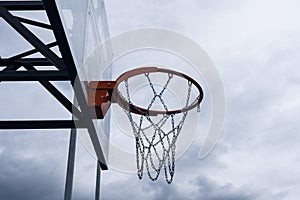 Basketball backboard with a ring, color photo processing. Black and white photo and ring highlighted in red. Focus on