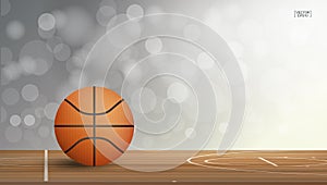 Basketball ball on basketball court area with light blurred bokeh background. Abstract background for basketball sport with light