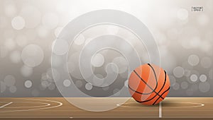 Basketball ball on basketball court area with light blurred bokeh background. Abstract background for basketball sport with light