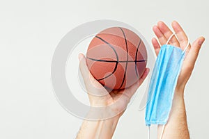 Basketball ball with medical mask